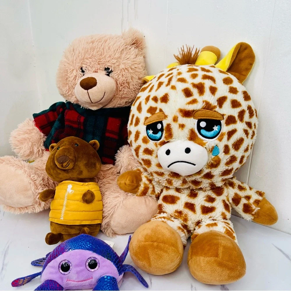 A lot of four Plush Giraffe, Tadebeare, Pig, and Fish Toy Set